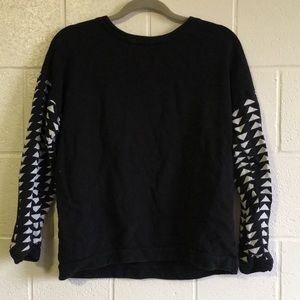black sweatshirt with patterned sleeves